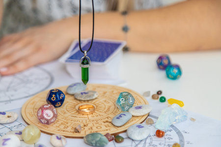 Woman numerologist astrologer counts numbers. Selective focusの写真素材