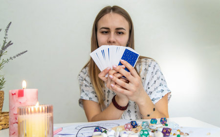 A fortune teller reads with tarot cards. Selective focus.の写真素材