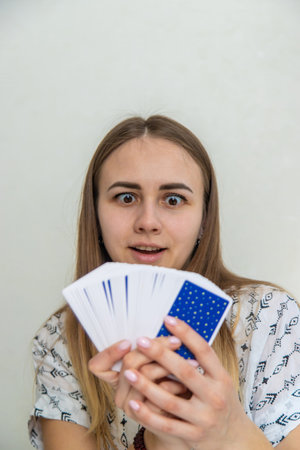 A fortune teller reads with tarot cards. Selective focus.