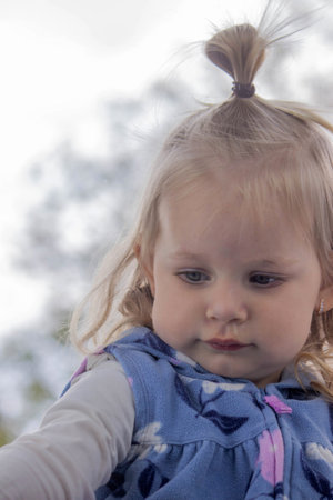 Close-up of a small child's face and nose with snot. Cold, runny nose in children, allergies.の写真素材