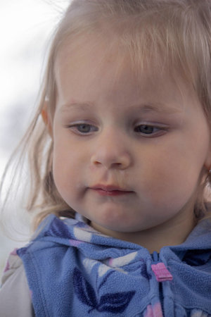 Close-up of a small child's face and nose with snot. Cold, runny nose in children, allergies.の写真素材