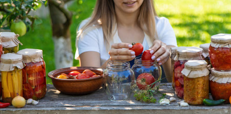 Woman Preserving Tomatoes and Vegetables in Garden.