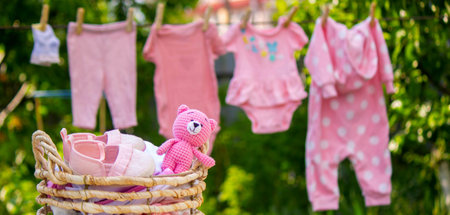 Children's clothes drying on a rope. Selective focus..