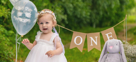 little beautiful girl celebrates her first birthday. boho style. holiday. cake.