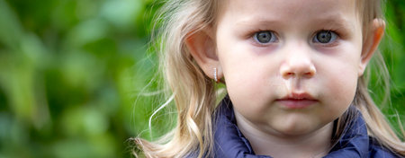 The little girl has a snot. Spring allergies.の写真素材