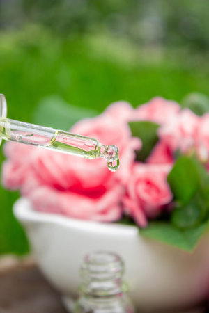 Rose essential oil in a bottle.essential oilsの写真素材