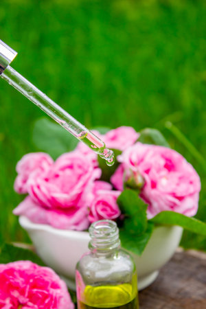 Rose essential oil in a bottle.essential oilsの写真素材