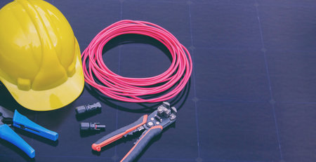 Solar Installation Tools and Safety Equipment on Solar Panel Surface.の写真素材
