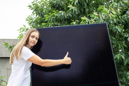 Female engineer showing class on solar panel background.Energy independence,green energy concept
