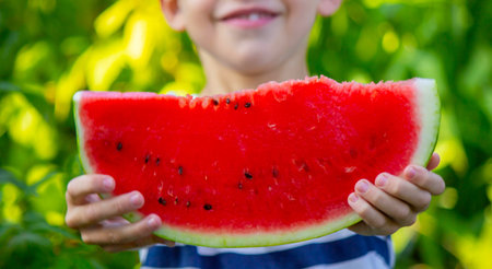 Happy boy eating watermelon. Summer.