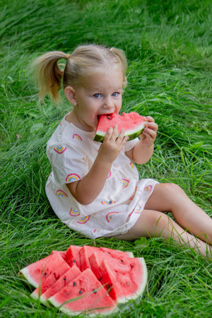 Happy child eating watermelon. Summer.の写真素材