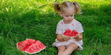 Happy child eating watermelon. Summer.の写真素材