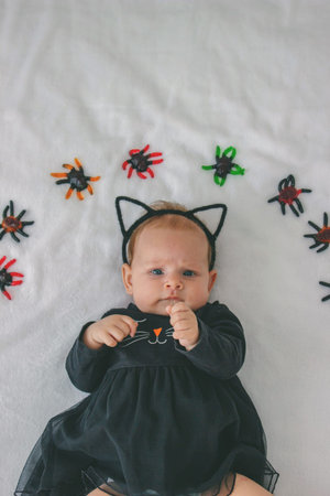 Little girl in a cat costume. Halloween idea for celebrating Halloween.