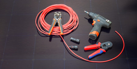 solar panel electrician tools red cable installation equipment renewable energy.の写真素材