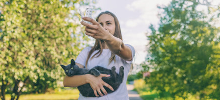 Woman holding a cat. Woman is allergic to cats. Allergy to cat furの写真素材