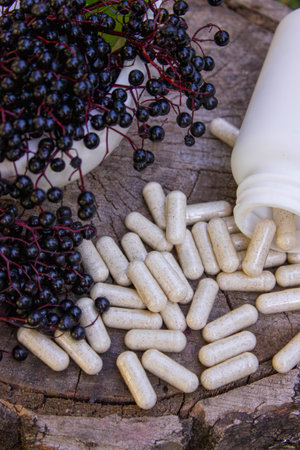 Natural remedies, capsules and immune supplements made from black elderberryの写真素材