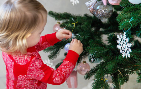 Little Girl Decorating the Christmas Tree.の写真素材