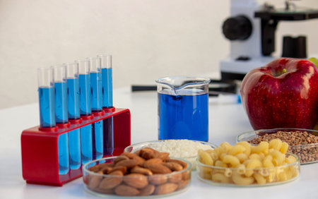 Food safety research: chemical test tubes, grains, nuts, and apples in a laboratory.
