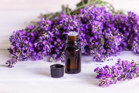 Lavender essential oil in glass dropper bottles with fresh flowersの写真素材