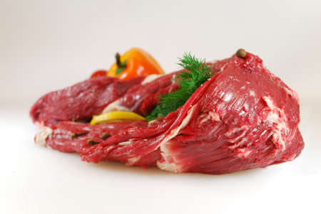 Raw meat with dill, lemon and pepperの写真素材