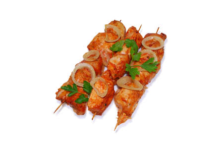 Shashlik on a wooden skewers isolated on white backgroundの写真素材