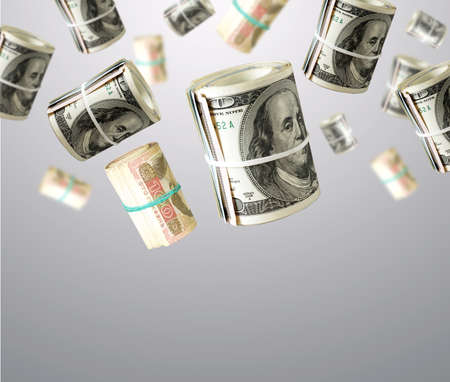 Rolls Of Unaited states Dollars and Ukrainian money. Abstract money backgroundの写真素材