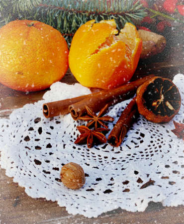 tangerines, spices, anise, cinnamon sticks and other vintage decorationsの写真素材