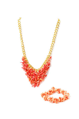 Beautiful pink necklace on a mannequin in front of white backgroundの写真素材