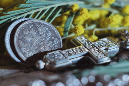 antique silver coins with the double-headed eagle and an Orthodox cross.の写真素材
