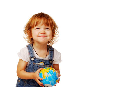 beautiful little girl in the age of two years holding a globe