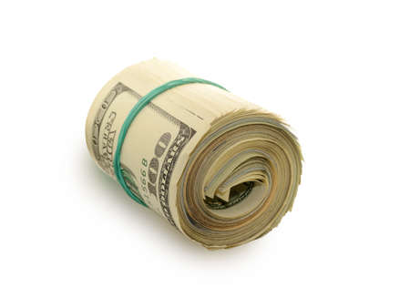 Stack of money dollars bounded by rubber band isolated on a white backgroundの写真素材