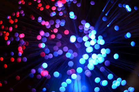 Blurred abstract pink and blue bokeh lights. Christmas holiday defocused background. Backdrop for your designの写真素材