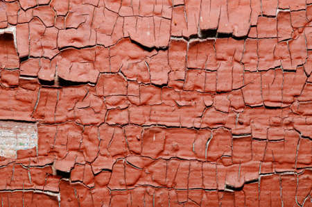 Red Painted old wall. Abstract cracked brown texture.の写真素材