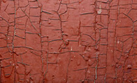 Red Painted old wall. Abstract cracked brown texture.の写真素材
