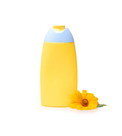 Shampoo bottle with calendula flower isolated on white background. Marigold extract.の写真素材