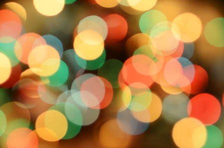 Bright christmas eve background. Plenty of golden sparkling bokeh from defocused garland lights. Backdrop for designの写真素材
