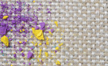 Close up picture of bright colorful powder on gunny textile. Concept photo for easy clean surfacesの写真素材