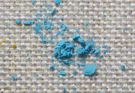 Close up picture of bright colorful powder on gunny textile. Concept for easy clean surfacesの写真素材