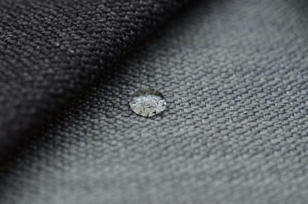 Close up water drop on gunny textile. Concept for easy clean, waterproof surfacesの写真素材