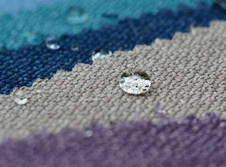Close up water drop on gunny textile. Concept for easy clean, waterproof surfacesの写真素材