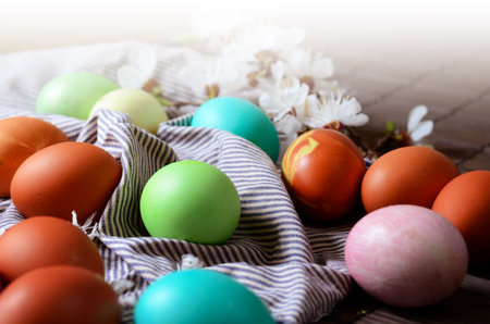 Easter background with traditional colored eggs on a rural table. Hipster background for orthodox...