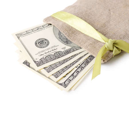 Close-up stack of one hundred dollar bills in a bag isolated on a white background.の写真素材