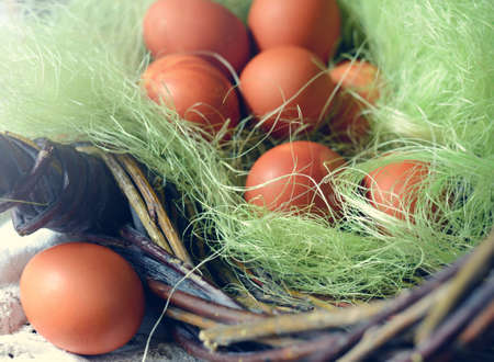 Easter background with traditional colored eggs on a rural table. Hipster background for orthodox and catholic holidayの写真素材