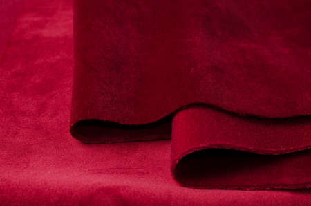Bright red velour textile samples. Fabric texture backgroundの写真素材