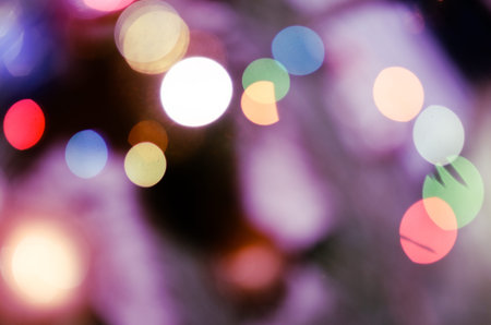Bright christmas eve background. Plenty of golden sparkling bokeh from defocused garland lights. Backdrop for designの写真素材