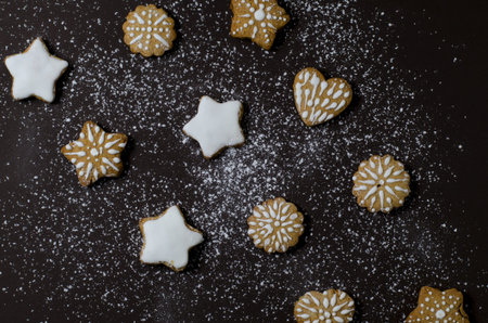 Top view Christmas layout with gingerbread cookies, on a dark background