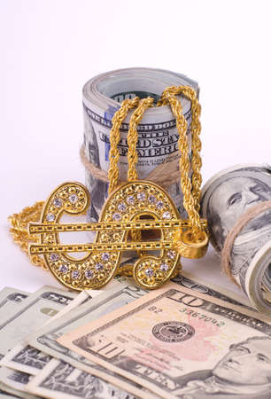 Gold Dollar Sign Necklace on a United States Dollars Banknotes. Financial business background.の写真素材