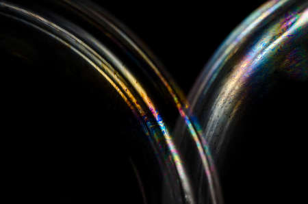 Abstract macro of soap bubble. Close up surface of soap bubble seems like planet in space. Bright creative background.の写真素材