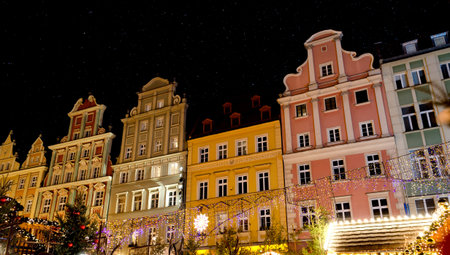 Festive Market of Rynek Square Against Traditional Colorful Old Buildings. Tourist attraction...