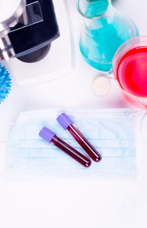 Blood test semple in lab. Coronavirus 2019-nCoV concept still life with blood test and drugs....